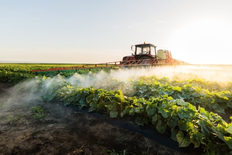 tractor spraying pesticides or herbicides
